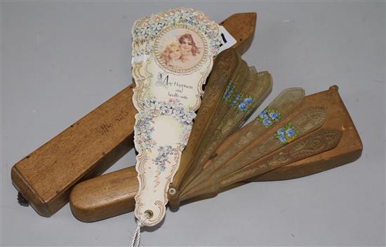 Two boxed sandalwood hand painted fans, a horn fan and an advertising fan